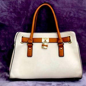 Semi new woman’s purse with padlock detail.